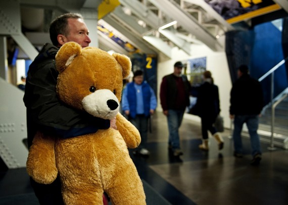 Michigan season ticket holder of 18 years Tom Berrodin holds a teddy bear before the game against Western Michigan on Saturday. "I've brought bigger," he says. Daniel Brenner I AnnArbor.com